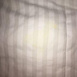 Yellowish stain on comforter.