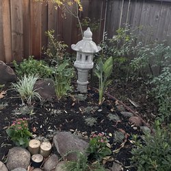 Feng Landscape Design - Rearranged landscaping that adds new plants while preserving the existing maple tree and original decorations