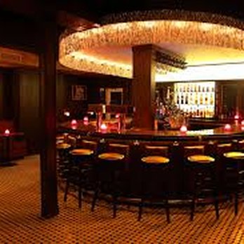 Goldie's - a dimly lit bar with stools - Bars Near Me - Brooklyn, New York