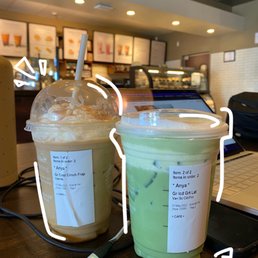 two cups of iced coffee on a table