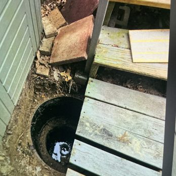 Clover Plumbing - Manhole into septic tank.  The hot tub on left made this a difficult job. - Plumbing Near Me - Hiram, Georgia