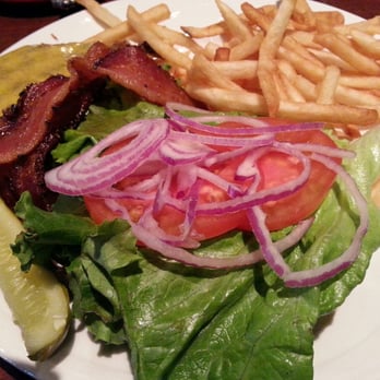 Bentley's Grill - Bently Burger ( peppered bacon, Tilamook cheddar cheese, red onion, lettuce and special sauce) Pickle and fries on the side. - New American Near Me - Salem, Oregon