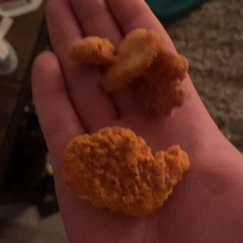 Wendy's - a hand holding a fried chicken nuggies - Burgers Near Me - Greenville, South Carolina Wendy's - a hand holding a fried chicken nuggies - Burgers Near Me - Greenville, South Carolina