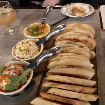 The Whale Chicago - Garlic toast and cucumber slices with three spreads:  Queso Chorizo, Pimento Cheese and Brie and almonds with a red chili topping. - New American Near Me - Chicago, Illinois