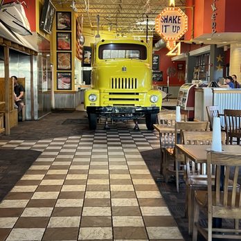Fuddruckers - a yellow truck in a restaurant - Burgers Near Me - Albuquerque, New Mexico
