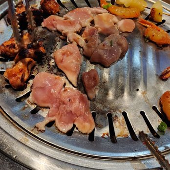 Taegukgi - a grill with meat and vegetables on it - Korean Near Me - Tucson, Arizona