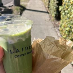Iced cloud matcha latte and croissant