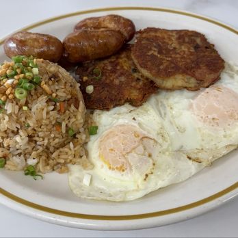 Kaua’i Diner - 2 eggs w/ 2 meat ($17.75): 4 longanisa (1 link is buried) and 2 homemade corned beef hash patties + fried rice upgrade (+$___?). Delicious!! - Breakfast & Brunch Near Me - Lihue, Hawaii