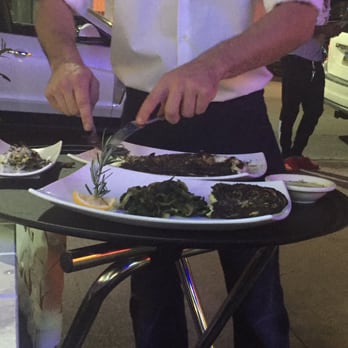 Poseidon - Whole Sea Bass being deboned by our fabulous waiter Nick! - Greek Near Me - Miami Beach, Florida