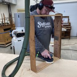 Shady Lawn Antiques - Nick Emigh and his sander.
