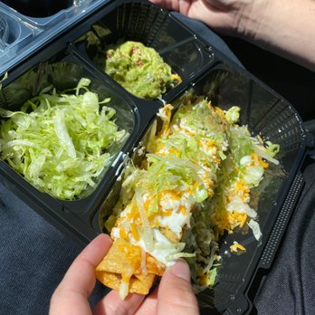 Mi Cocina Mexican Restaurant - a person holding a tray of food - Mexican Near Me - Littleton, Colorado Mi Cocina Mexican Restaurant - a person holding a tray of food - Mexican Near Me - Littleton, Colorado