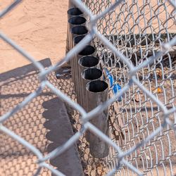 Mas Fukai Park - Tubes for bats in the dugout by Softball Field #2