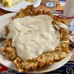 Eggs and Hand Breaded Chicken Fried Steak platter with hash browns and a biscuit (the CFS was on its own plate!) Eggs and Hand Breaded Chicken Fried Steak platter with hash browns and a biscuit (the CFS was on its own plate!)