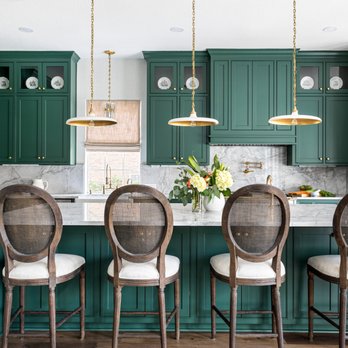 Romo Remodeling - a kitchen with green cabinets and white marble countertops - General Contractors Near Me - katy, Texas
