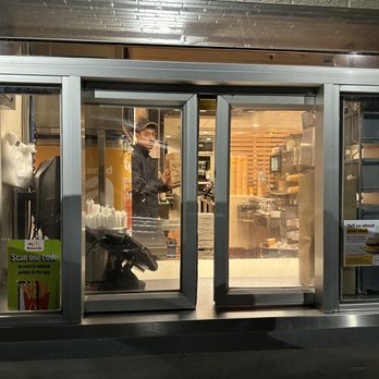 McDonald's - a man in the window of a restaurant - Burgers Near Me - Highwood, Illinois McDonald's - a man in the window of a restaurant - Burgers Near Me - Highwood, Illinois