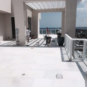 Pintos Floor - a patio with a view of the ocean - Flooring Near Me Pintos Floor - a patio with a view of the ocean - Flooring Near Me