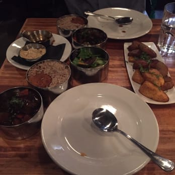Calabash Bistro - Oxtail meal. Dark photo though - Caribbean Near Me - Vancouver, British Columbia