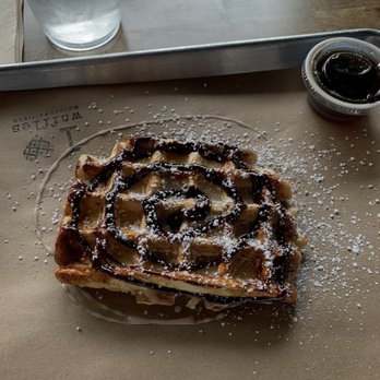 Press Waffle Co. - a waffle on a tray with powdered sugar - Breakfast & Brunch Near Me - Little Rock, Arkansas Press Waffle Co. - a waffle on a tray with powdered sugar - Breakfast & Brunch Near Me - Little Rock, Arkansas