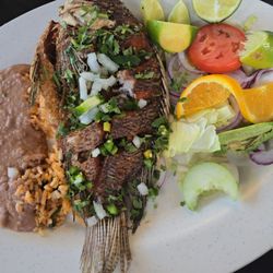Mojarra frita. I added the cilantro and onions. Very delicious.