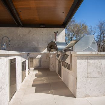 The Grill Store - White stoned outdoor kitchen under shade structure including grill, sink and pizza oven. - Grilling Equipment Near Me - Frisco, Texas The Grill Store - White stoned outdoor kitchen under shade structure including grill, sink and pizza oven. - Grilling Equipment Near Me - Frisco, Texas