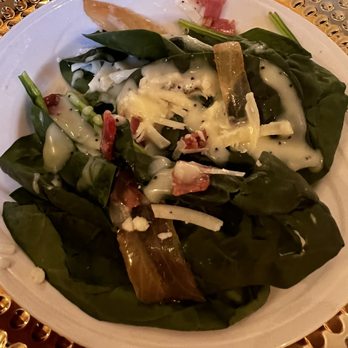 Wilder Mansion - A mixed salad featuring leafy greens, melted cheese, bacon bits, and grilled vegetables, served on a white plate. - Venues & Event Spaces Near Me - Elmhurst, Illinois