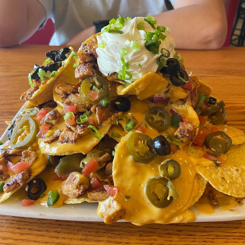 Regular (size) nachos added chicken Regular (size) nachos added chicken
