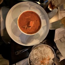 Tikka Indian Cuisine - Butter chicken just a different angle. Bowl of rice is included with any curry. Also I highly suggest getting the cheese and garlic naan!!