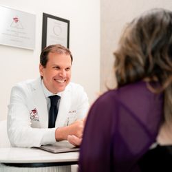 Andrew Smith, MD, FACS - Dr. Smith with patient in the consult room