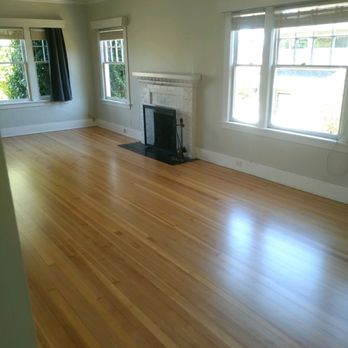 A & B Hardwood Flooring - a fireplace and windows - Flooring Near Me