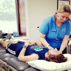 Crest Physical Therapy - Therapist working with patient.