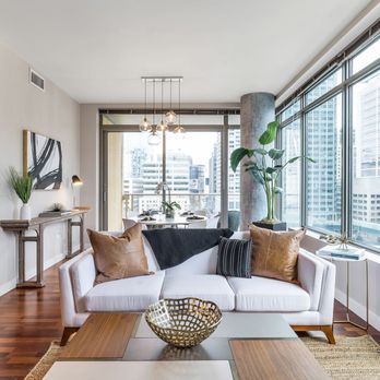 Savvy Staging - Wall of windows living room. - Home Staging Near Me