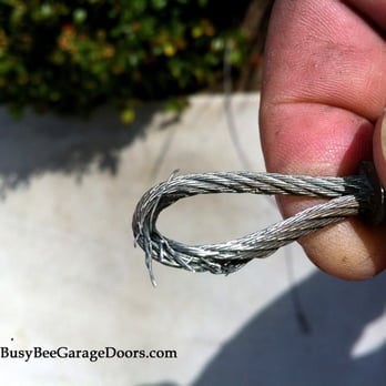 Busy Bee Garage Doors - Frayed Cables. It is important to replace cables once they begin to fray. - Garage Door Services Near Me Busy Bee Garage Doors - Frayed Cables. It is important to replace cables once they begin to fray. - Garage Door Services Near Me