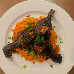 Shepp’s Cosmic Kitchen - Homemade Birria grilled chicken over curried rice
