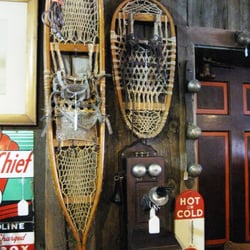 Town & Country Antique Shop - Antique Oak wall phone, snowshoes, country store thermometer, SKY CHIEF gas sign