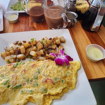 The New West Orange Diner - Santa Fe omelet with hash browns, and a delicious green sauce. - Coffee & Tea Near Me - West Orange, New Jersey The New West Orange Diner - Santa Fe omelet with hash browns, and a delicious green sauce. - Coffee & Tea Near Me - West Orange, New Jersey