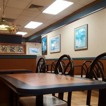 McDonald's - a table and chairs in a restaurant - Fast Food Near Me - Syosset, New York