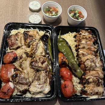 Kabob Grill N' Go - Pork rib combo on the left with basmati rice grilled vegs and Shirazi salad  Chicken thigh combo on the right - Mediterranean Near Me - Phoenix, Arizona