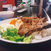 Photo of Long Bay - New York, NY, United States. Pork Chops over rice.