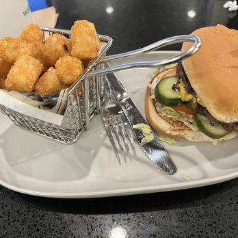 Wahlburgers - Double patty and tots, I like the pickles they look really great. Potatoes are tots, what's that about? - Burgers Near Me - Boston, Massachusetts Wahlburgers - Double patty and tots, I like the pickles they look really great. Potatoes are tots, what's that about? - Burgers Near Me - Boston, Massachusetts