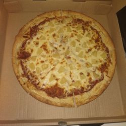 LARGE pineapple pizza. Looks like a small pizza, right?