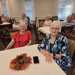 Twin Rivers Senior Living - Residents socializing at tables