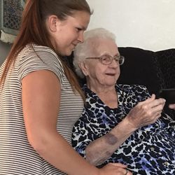 Brianne sharing modern technology with Grandma Ruth