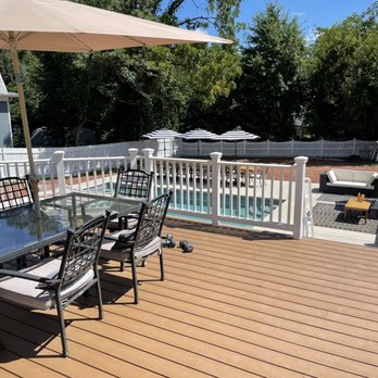 Rivas Design & Landscaping - a deck overlooking a pool - Landscaping Near Me - Manassas, Virginia Rivas Design & Landscaping - a deck overlooking a pool - Landscaping Near Me - Manassas, Virginia