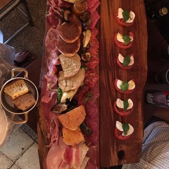 Pane e Salame - Huge, delicious charcuterie board. Plus a caprese. So tasty! - Wine Bars Near Me - Rome, RM Pane e Salame - Huge, delicious charcuterie board. Plus a caprese. So tasty! - Wine Bars Near Me - Rome, RM