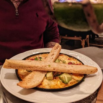 Mariel - Huevos Habaneros chorizo-baked eggs with onions and peppers, sofrito sauce, avocado, queso Havana and Cuban toast - Cuban Near Me - Boston, Massachusetts Mariel - Huevos Habaneros chorizo-baked eggs with onions and peppers, sofrito sauce, avocado, queso Havana and Cuban toast - Cuban Near Me - Boston, Massachusetts