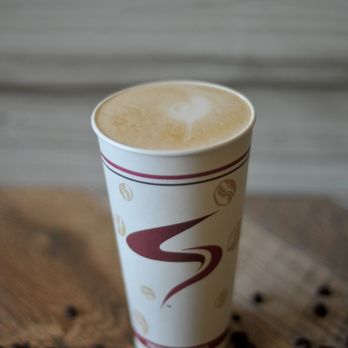 Aroma Joe's - a cup of coffee on a table - Coffee & Tea Near Me - Orono, Maine