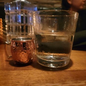 Starlite - Water glass next to a small cup of ginger! - Cocktail Bars Near Me - San Diego, California