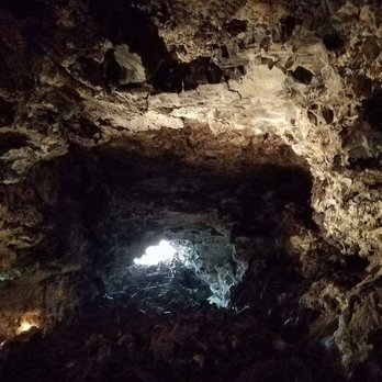Kula Kai Caverns - View of the entrance from 50 steps in. - Tours Near Me Kula Kai Caverns - View of the entrance from 50 steps in. - Tours Near Me