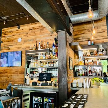 Bakersfield Mass Ave - Bakersfield has a whole lot of rooms or areas.  We saw an outside patio out back, there appears to be a downstairs, a side room with tables. - Bars Near Me - Indianapolis, Indiana