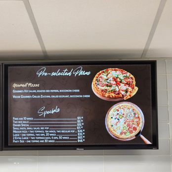 Gusto Pizzaria - a menu on a wall - Pizza Near Me - Brampton, Ontario Gusto Pizzaria - a menu on a wall - Pizza Near Me - Brampton, Ontario